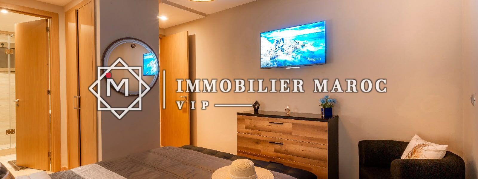 Chambre avec télévision et commode, appartement meublé à louer à Prestigia, Marrakech